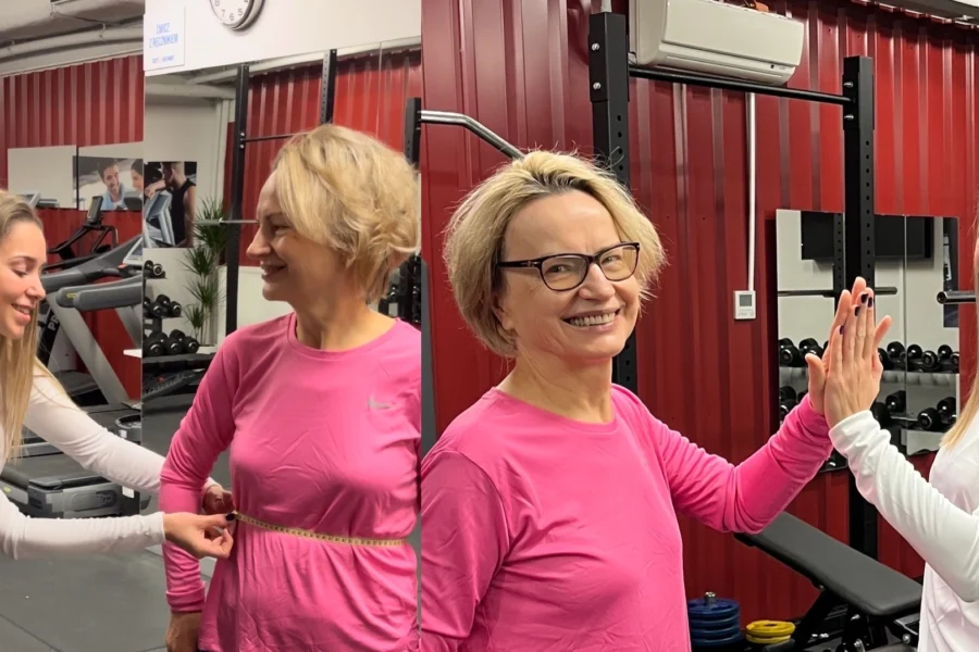 Trener wykonuje pomiary obwodów taśmą w studio Body Movement Mokotów